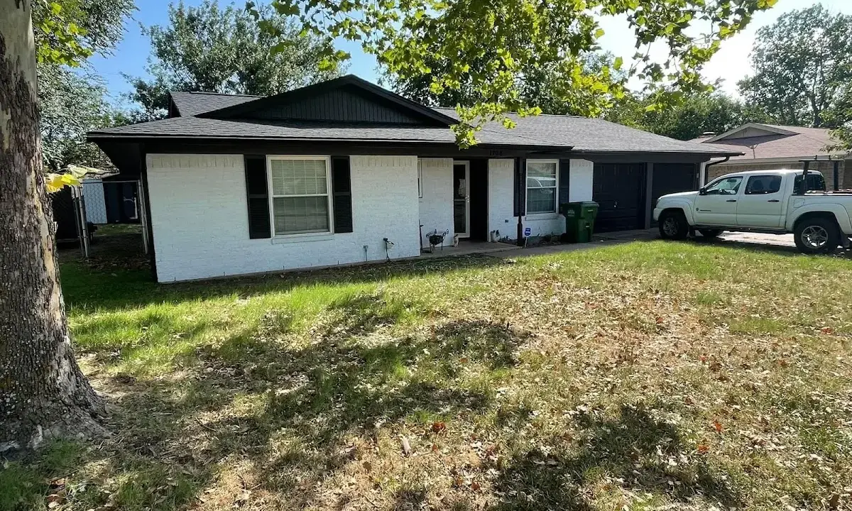 Professional roofing crew working on a residential roof in Martic
